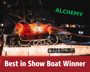 Photo of a boat with lights depicting a sled that was in the 9th Annual Parade of Boats. This photo explains they were this year's winner.